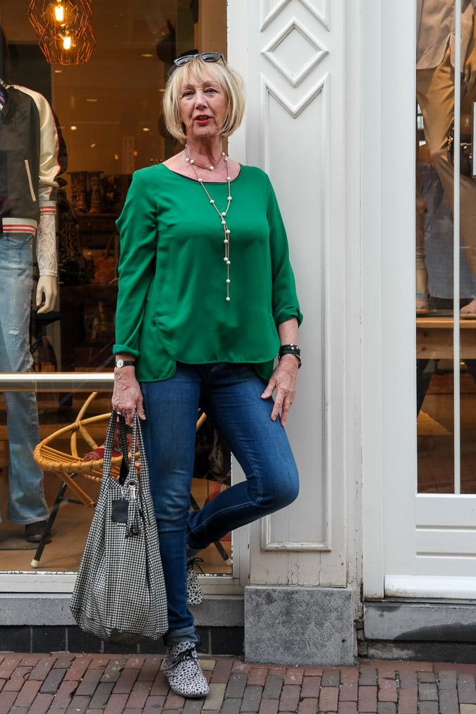 Green top, Denham jeans, black and white shoes and bag