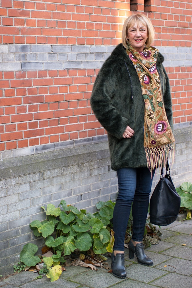 Red sweater and a green faux fur coat