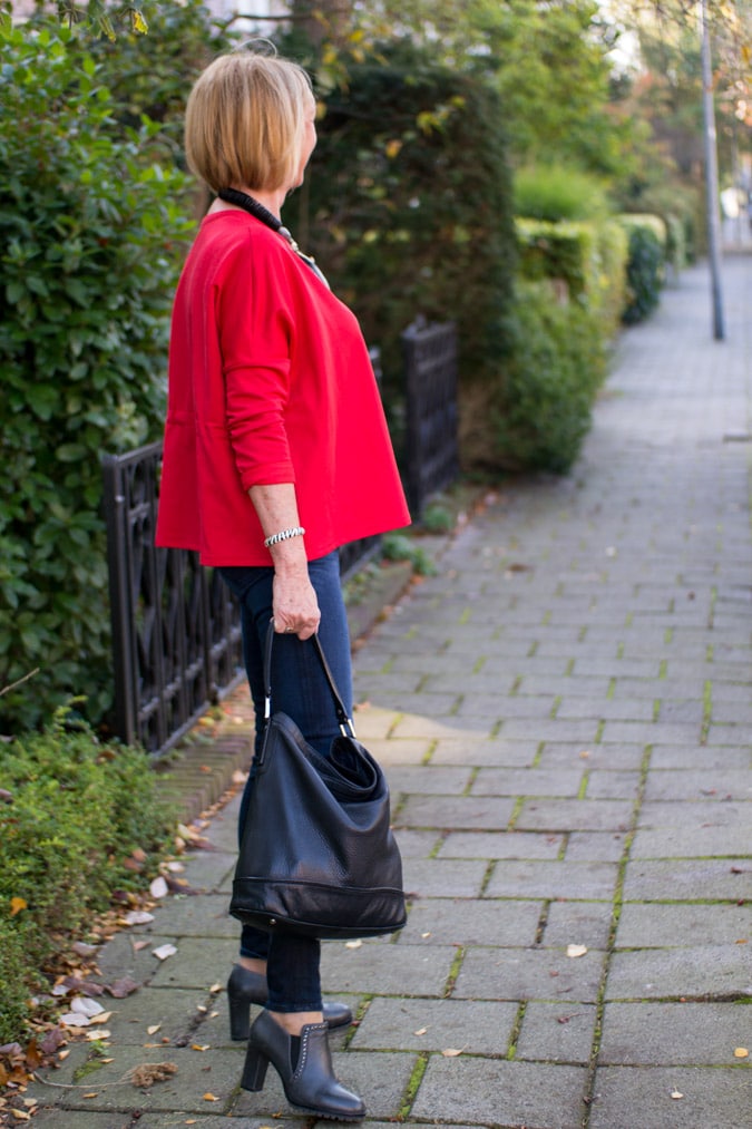 Red sweater and a green faux fur coat