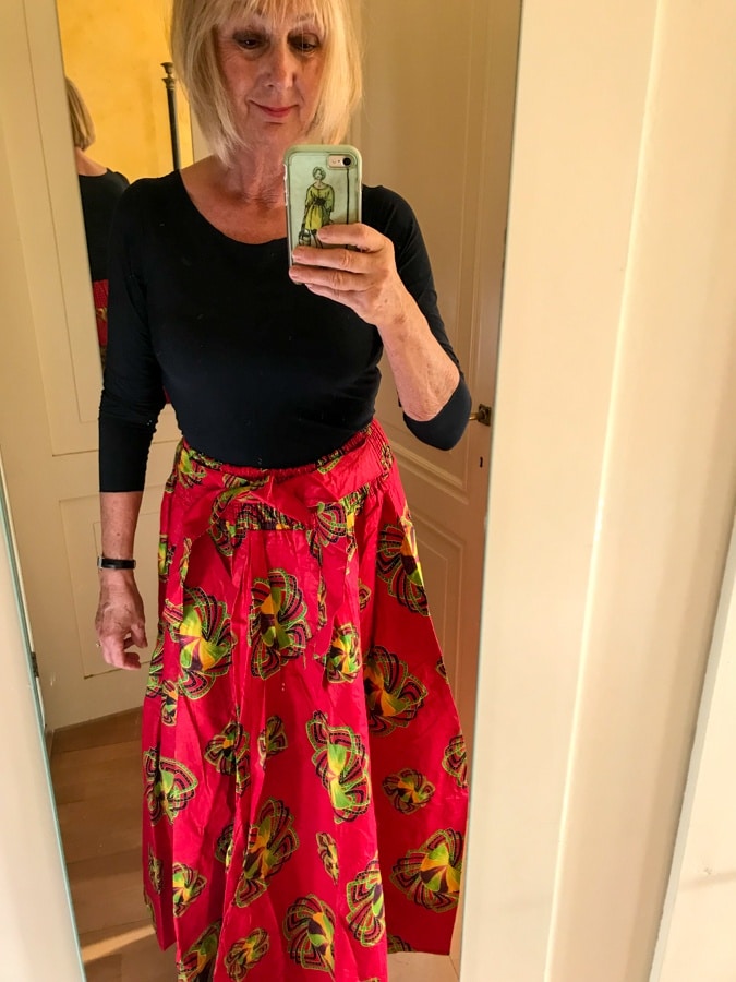 wide red skirt with black top
