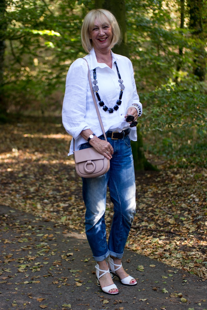 boyfriend jeans with white linen shirt and blush pink cross body bag