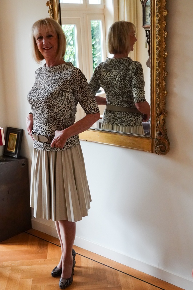 Leopard print top with cream pleated skirt