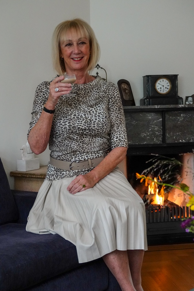 Leopard print top with cream pleated skirt