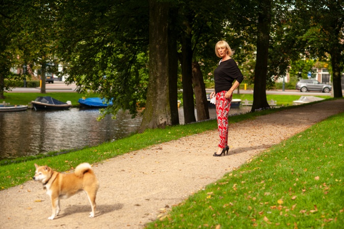 Red trousers with tigers and black top
