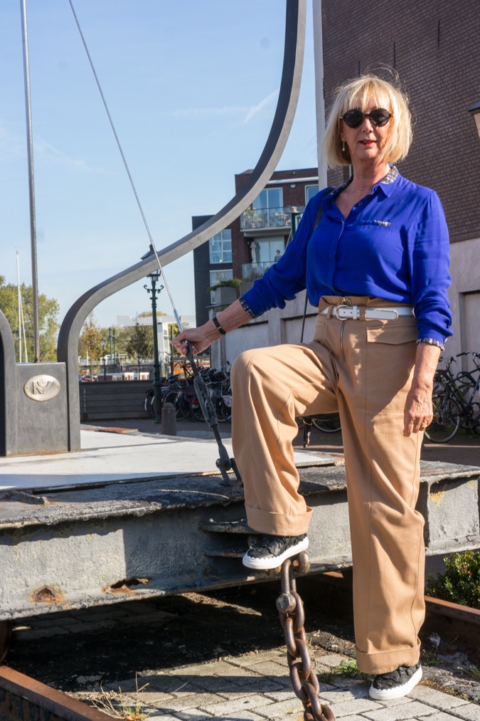Khaki trousers and blue shirt