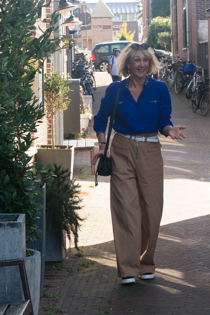 Khaki trousers and blue shirt
