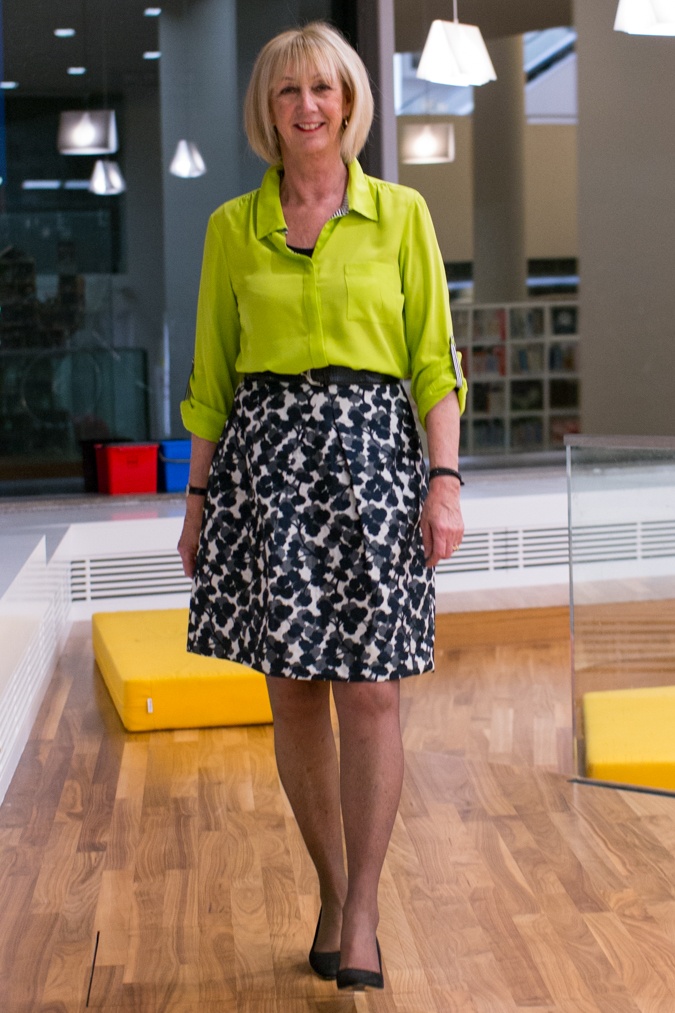 Lime shirt with black and white A-line skirt