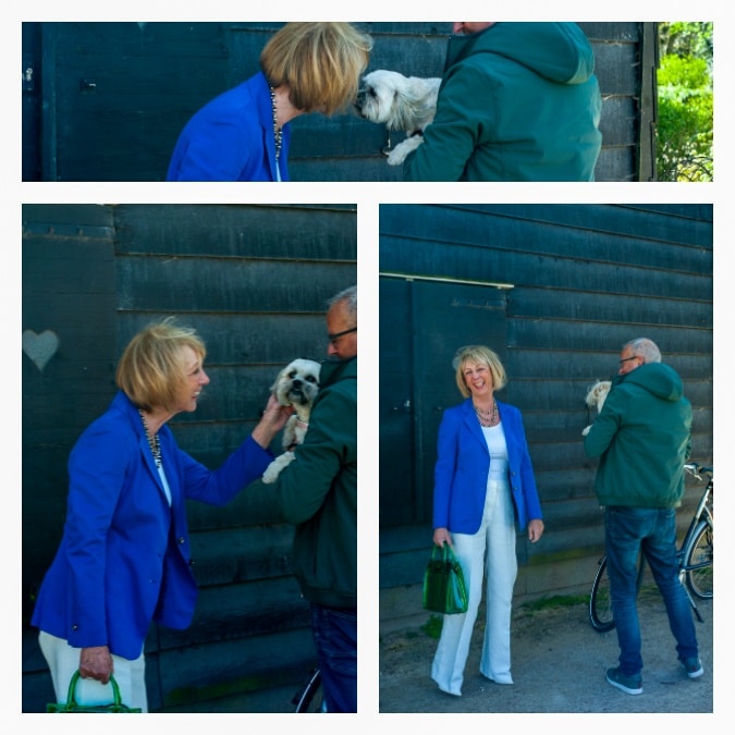 White flared trousers with a bright blue jacket