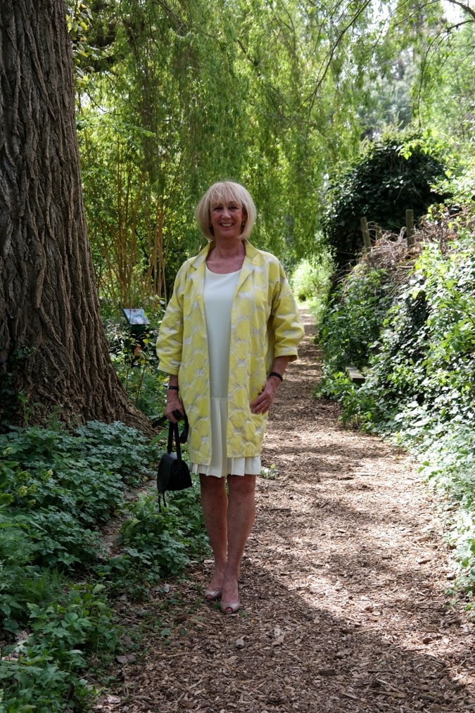 Yellow sleeveless dress with yellow jacket