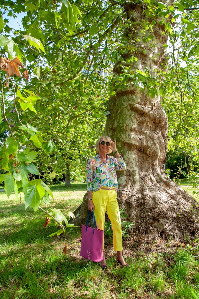 Lemon yellow trousers and a multi-coloured shirt