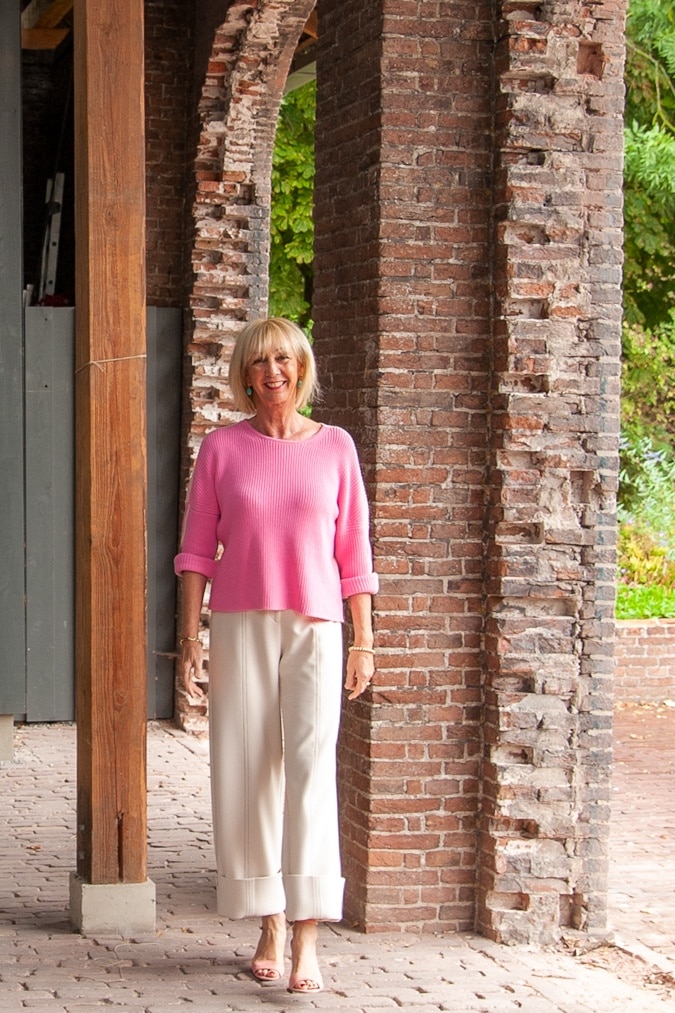 cream trousers and pink jumper