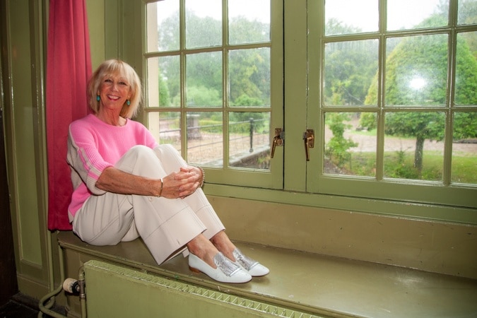 cream trousers and pink jumper