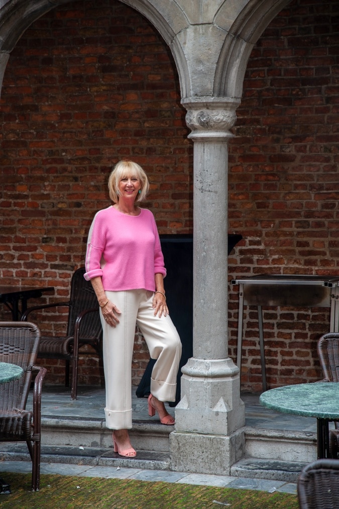 cream trousers and pink jumper