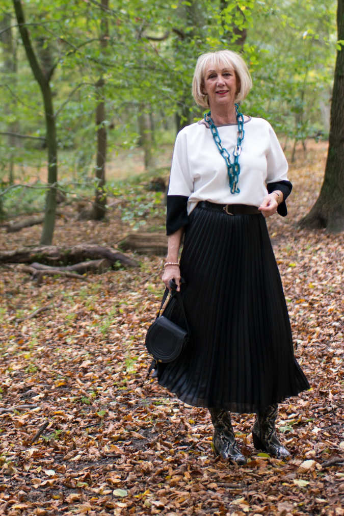 Python boots with black pleated skirt