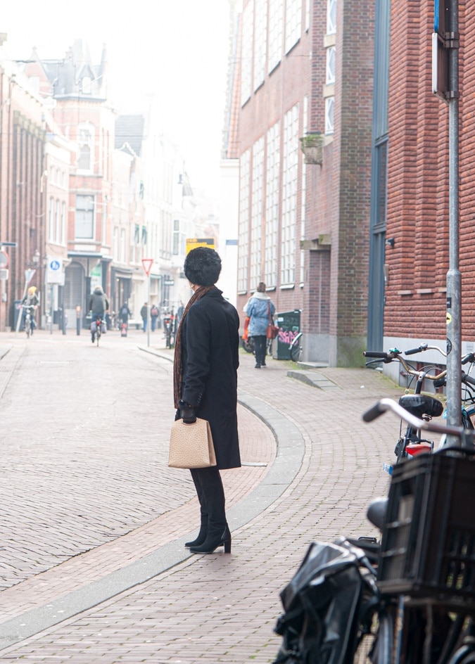 Black Max Mara coat and faux fur hat