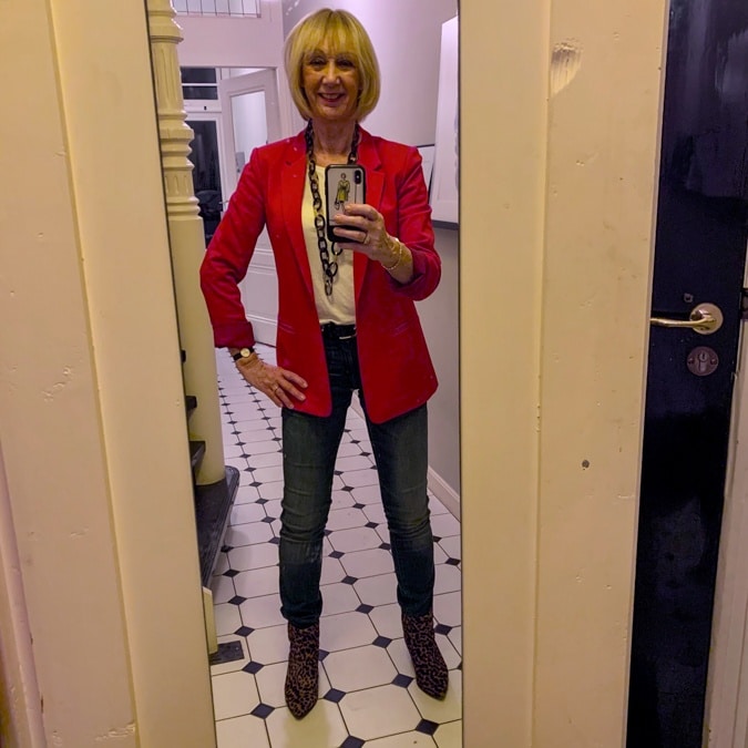 Red jacket on jeans