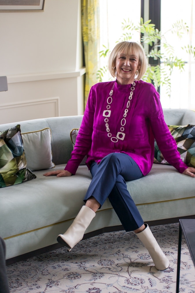 Bright purple blouse on 7/8 blue trousers