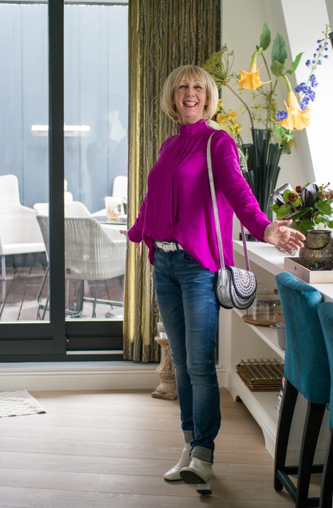 Bright purple blouse on jeans