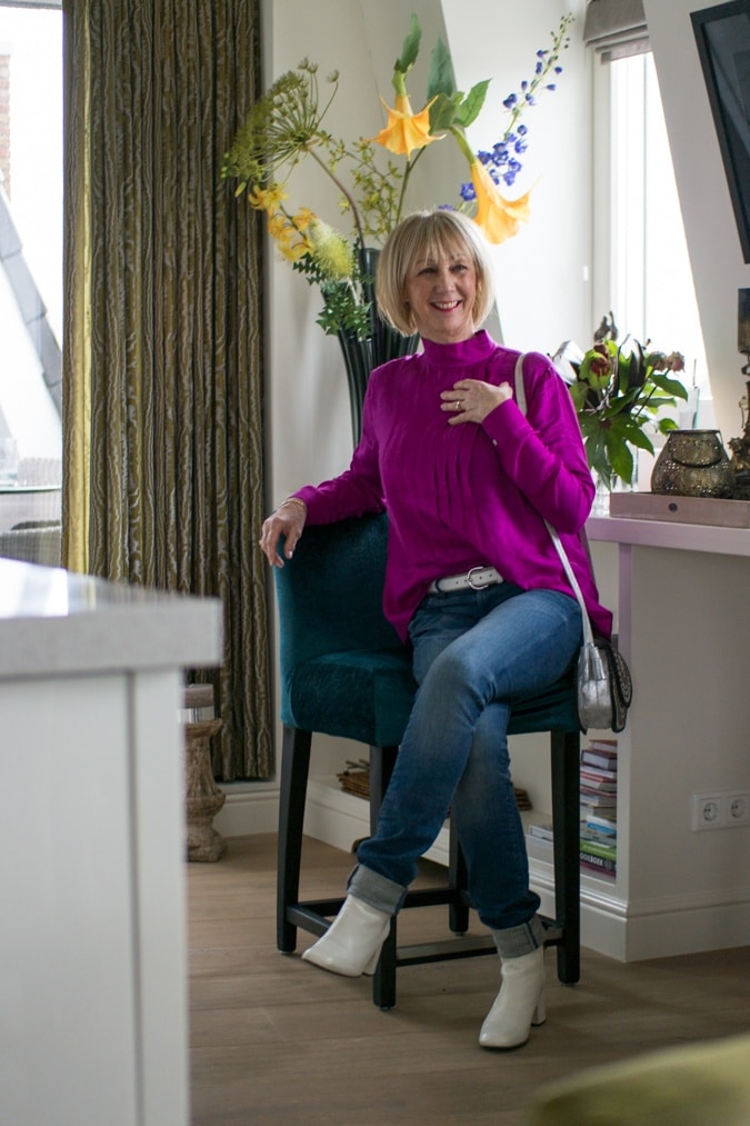 Bright purple blouse on jeans