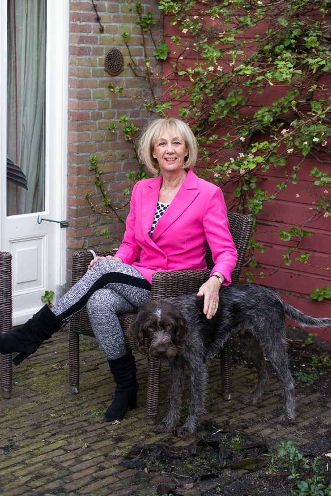 Bright pink jacket with houndstooth leggings