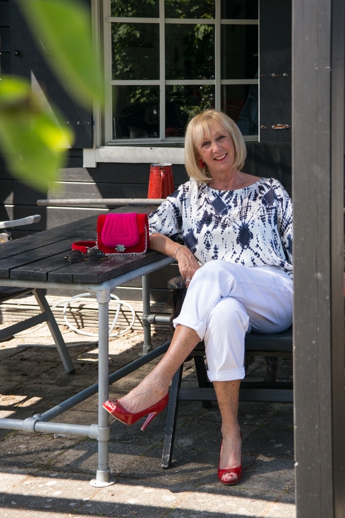 Silver and blue silk blouse with red peep toe pumps