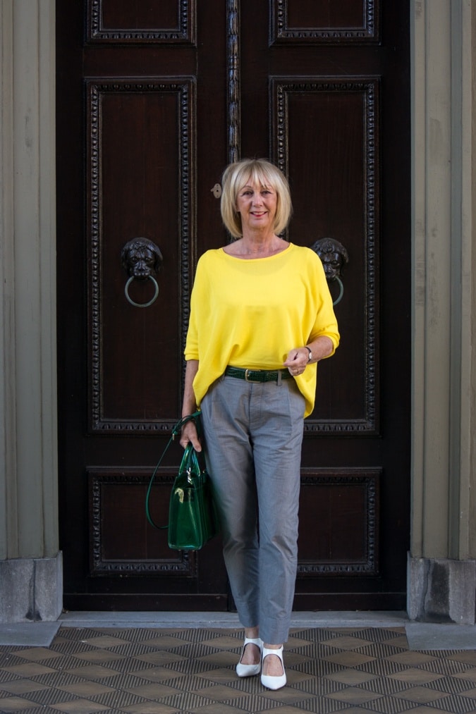 Grey trousers with a yellow jumper