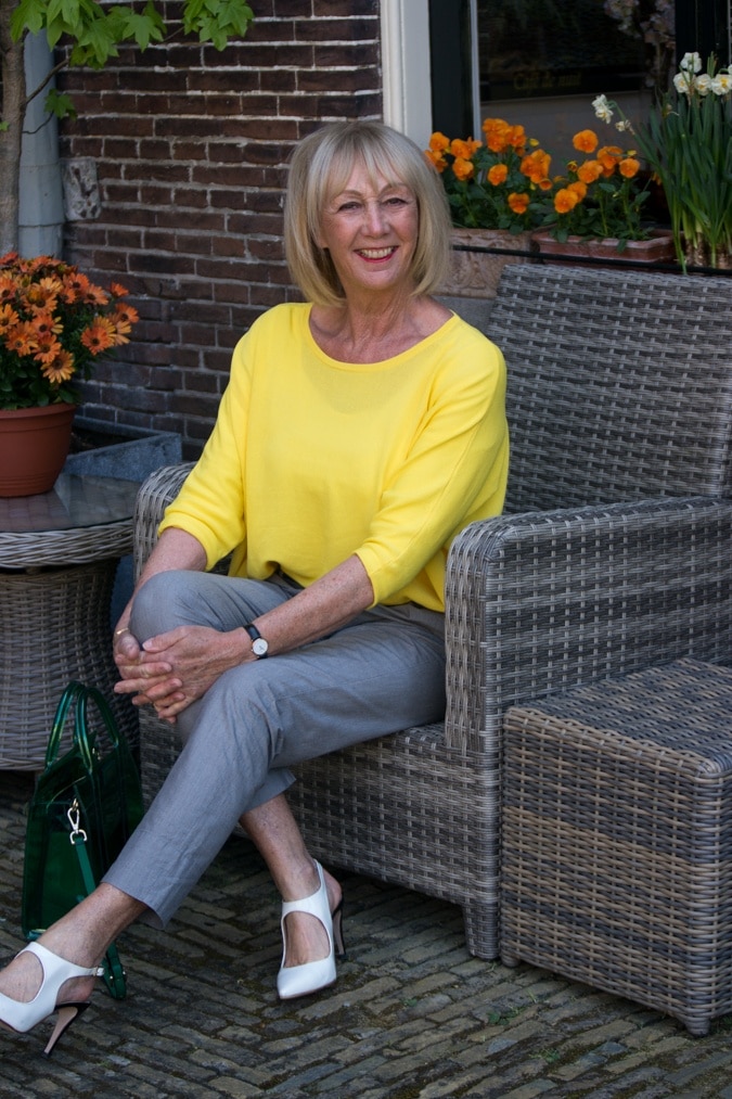 Grey trousers with a yellow jumper