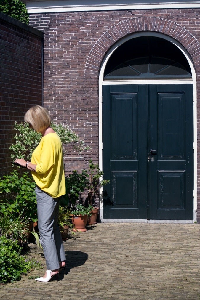 Grey trousers with a yellow jumper