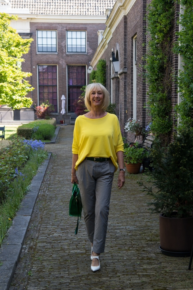 Grey trousers with a yellow jumper