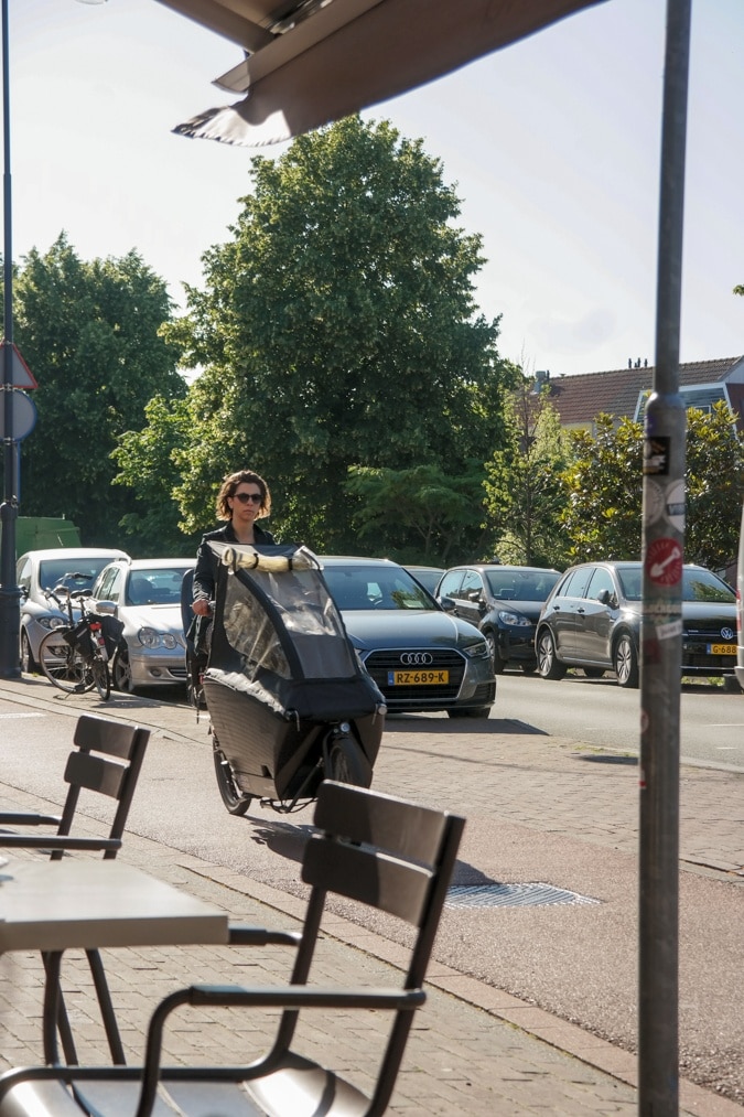 Woman with kid on a bike