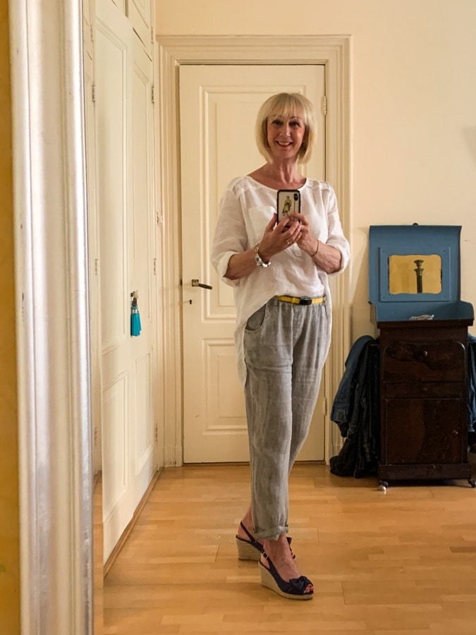 Grey linen trousers and white shirt