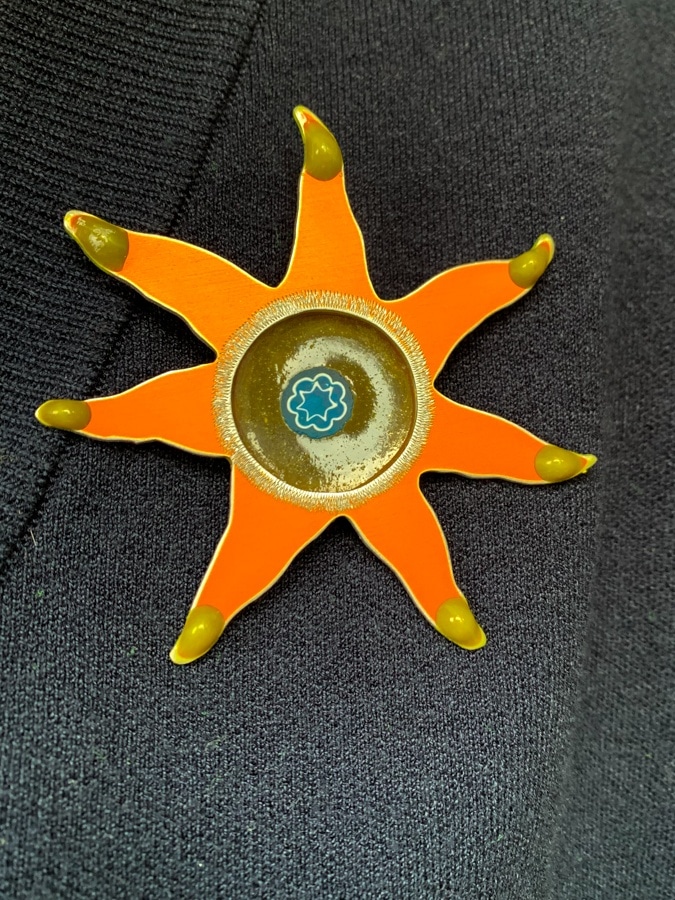 Orange brooch by Sylvia Blickman
