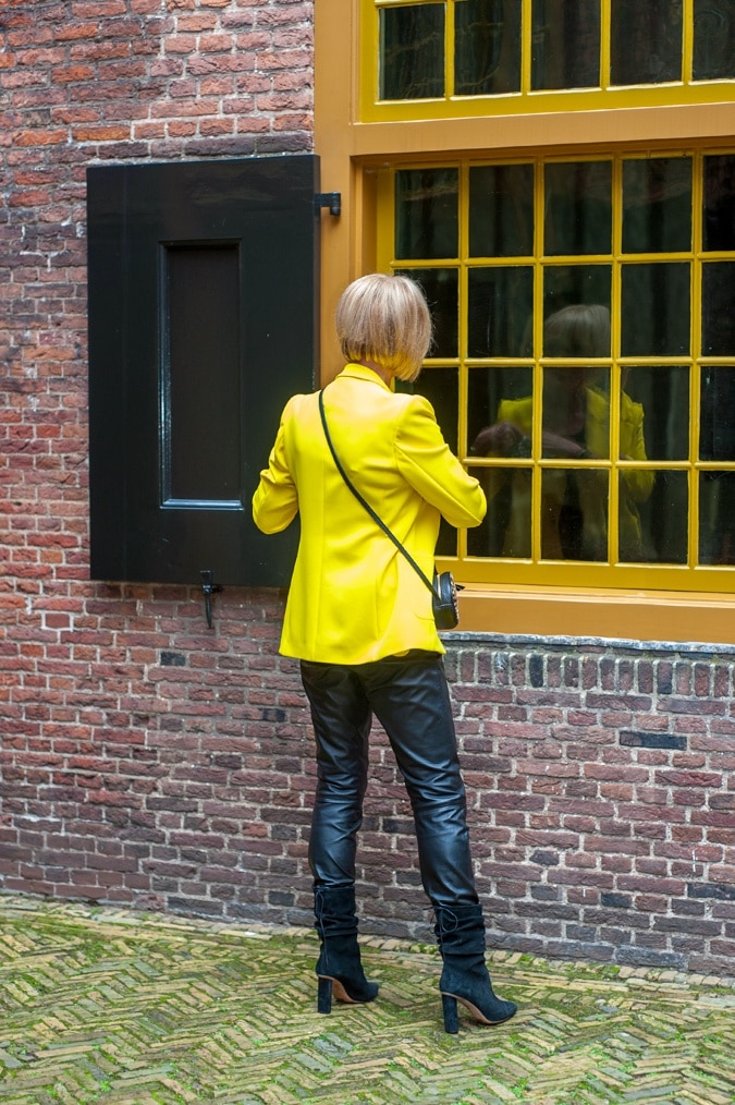 Yellow jacket with black leather trousers