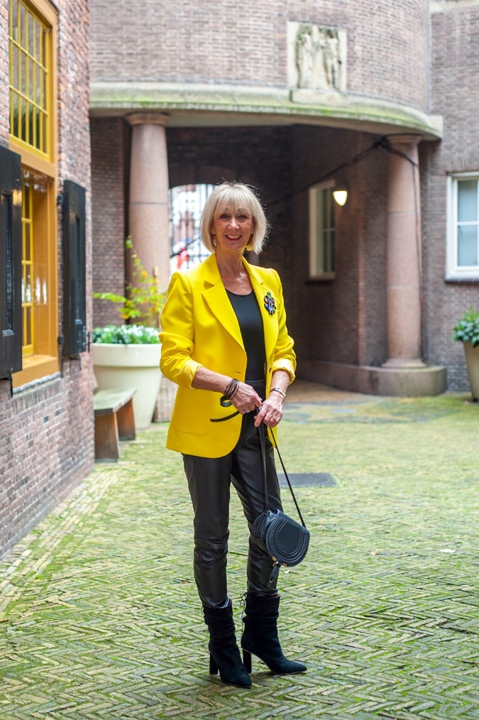 Yellow jacket with black leather trousers