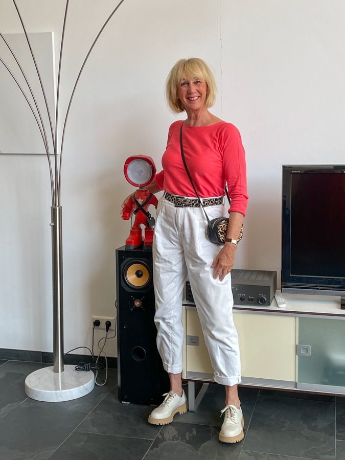 Coral jumper with white trousers
