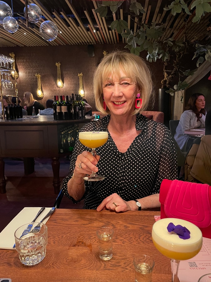 drinking a cocktail