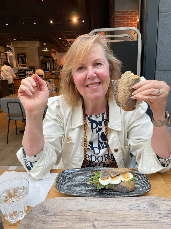 Marjolein eating a sandwich