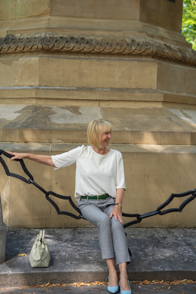Grey trousers with a cream top in The Hague
