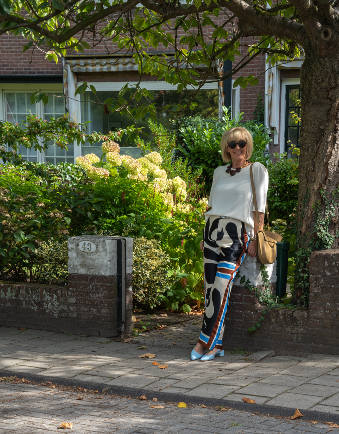 Arty print trousers with cream top