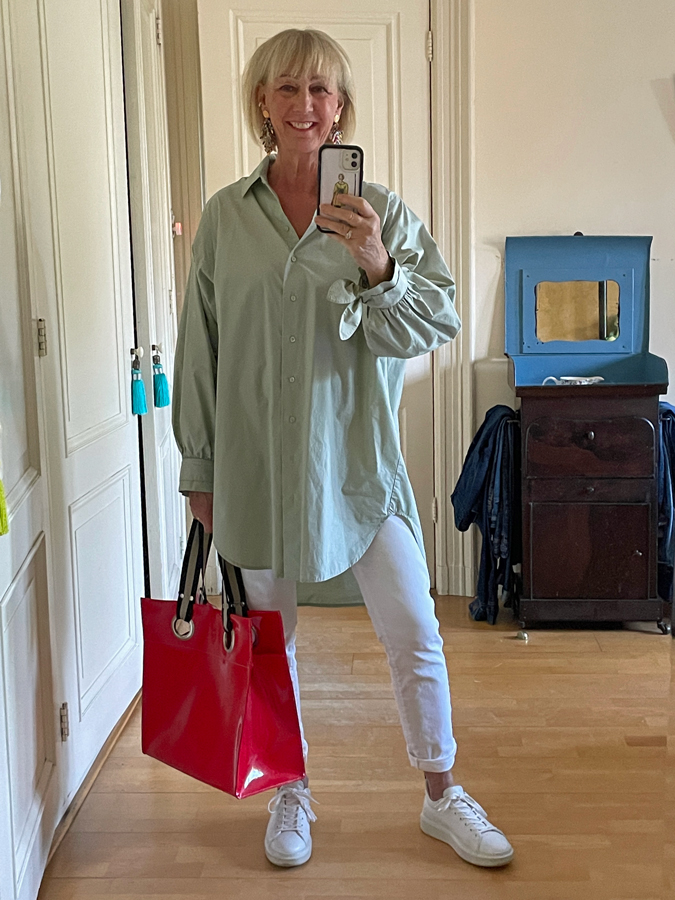 pastel green shirt with white jeans