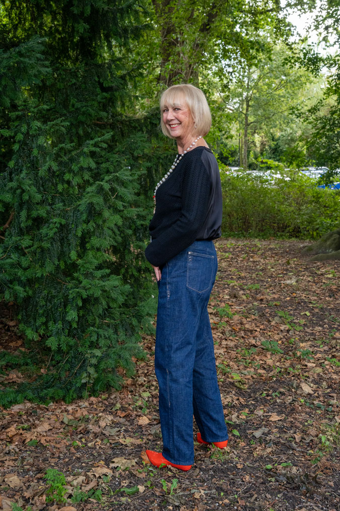 Baggy jeans with a black jumper and orange boots