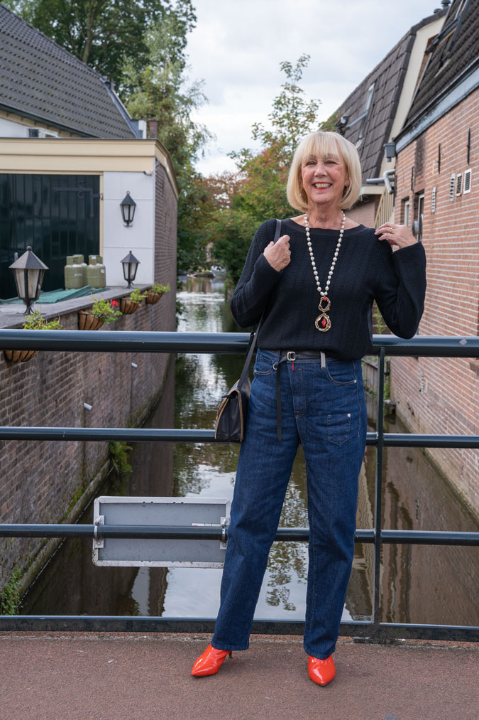Baggy jeans with a black jumper and orange boots